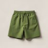 Birch Trail Short in Moss — lightweight trail shorts with an elastic drawcord waist, folded on a light grey backdrop