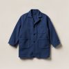 Harbor Chore Coat in Navy — boxy button-front chore coat with two patch pockets on a light grey backdrop