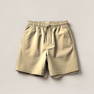 Driftwood Trail Short in Sand — lightweight trail shorts with an elastic drawcord waist, folded on a light grey backdrop