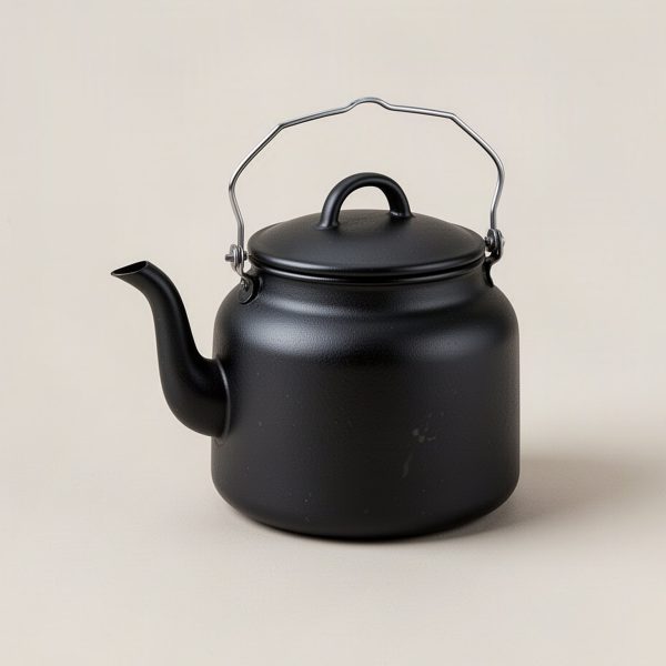 Ember Kettle — matte black enamelled camp kettle with a spout and wire bail handle on a light grey backdrop