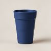 Ember Pint Cup in Navy — stackable pint cup with a flared rim on a light grey backdrop