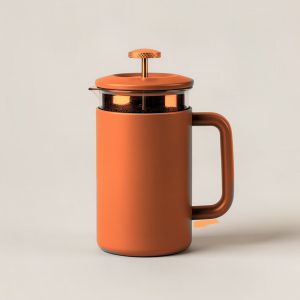 Ember Travel Press in Rust — travel coffee press mug with a plunger lid and a handle on a light grey backdrop