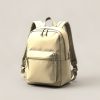 Granite Daypack in Sand — zip-top daypack with padded shoulder straps and a front pocket on a light grey backdrop