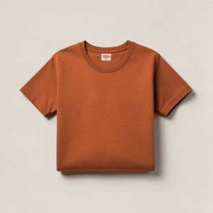 Granite Field Tee in Rust — crew-neck cotton t-shirt, folded on a light grey backdrop