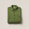 Granite Flannel Shirt in Moss — button-up flannel shirt, folded on a light grey backdrop