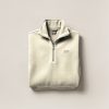 Granite Fleece Pullover in Cream — quarter-zip fleece pullover, folded on a light grey backdrop