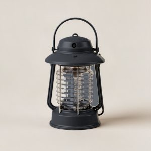 Granite Lantern in Charcoal — camp lantern with a domed top, carry handle and ribbed diffuser on a light grey backdrop