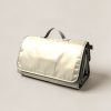 Granite Picnic Blanket in Cream — water-resistant picnic blanket, folded with a carry handle on a light grey backdrop