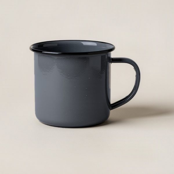 Harbor Enamel Mug in Charcoal — enamel camp mug with a rolled rim and a C-shaped handle on a light grey backdrop