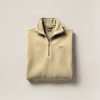 Harbor Fleece Pullover in Sand — quarter-zip fleece pullover, folded on a light grey backdrop