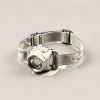 Harbor Headlamp in Cream — compact headlamp with a lens housing and an elastic headband on a light grey backdrop