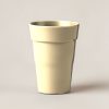 Harbor Pint Cup in Sand — stackable pint cup with a flared rim on a light grey backdrop