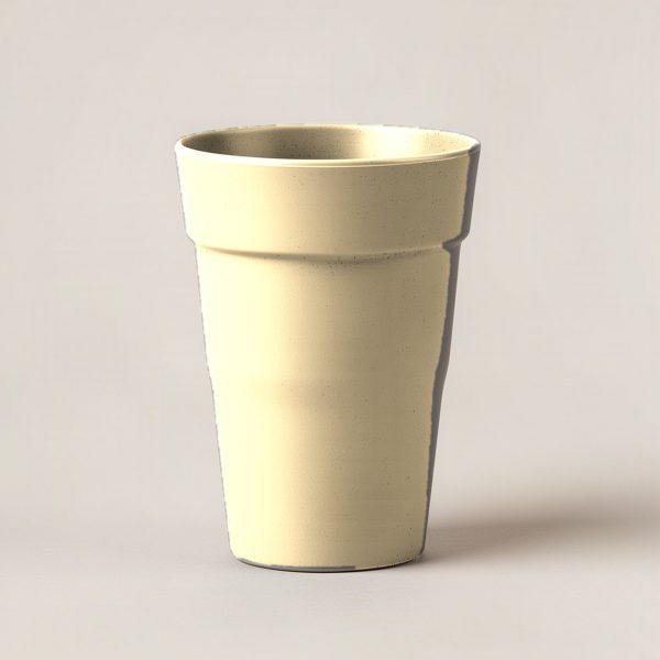 Harbor Pint Cup in Sand — stackable pint cup with a flared rim on a light grey backdrop