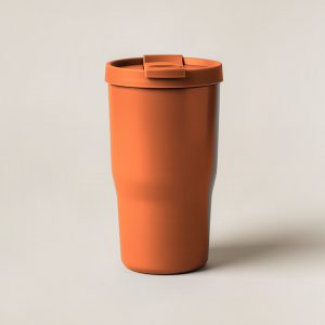 Juniper Camp Tumbler in Rust — straight-sided insulated camp tumbler with a slip-on lid on a light grey backdrop
