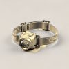 Juniper Headlamp in Sand — compact headlamp with a lens housing and an elastic headband on a light grey backdrop