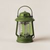 Juniper Lantern in Moss — camp lantern with a domed top, carry handle and ribbed diffuser on a light grey backdrop