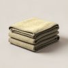 Lakeside Wool Blanket in Sand — thick woven wool blanket with stitched edges, folded on a light grey backdrop