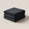 Ridgeline Wool Blanket in Charcoal — thick woven wool blanket with stitched edges, folded on a light grey backdrop