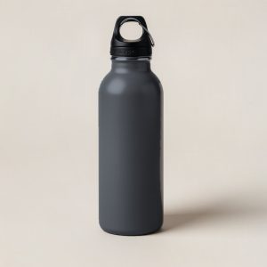 Cedar Steel Bottle in Charcoal — tall insulated steel water bottle with a screw-on cap and carry loop on a light grey backdrop