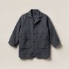 Summit Chore Coat in Charcoal — boxy button-front chore coat with two patch pockets on a light grey backdrop