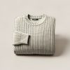 Summit Watch Sweater in Cream — chunky ribbed-knit crew-neck sweater, folded on a light grey backdrop