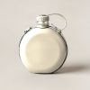 Trailhead Canteen in Cream — round flat-sided canteen with a screw cap and a carry strap on a light grey backdrop