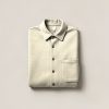 Trailhead Flannel Shirt in Cream — button-up flannel shirt, folded on a light grey backdrop