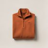 Trailhead Fleece Pullover in Rust — quarter-zip fleece pullover, folded on a light grey backdrop