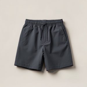 Trailhead Trail Short in Charcoal — lightweight trail shorts with an elastic drawcord waist, folded on a light grey backdrop