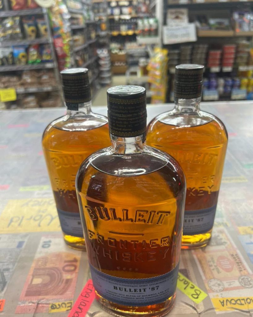 Bulleit bourbon bottles on the counter
