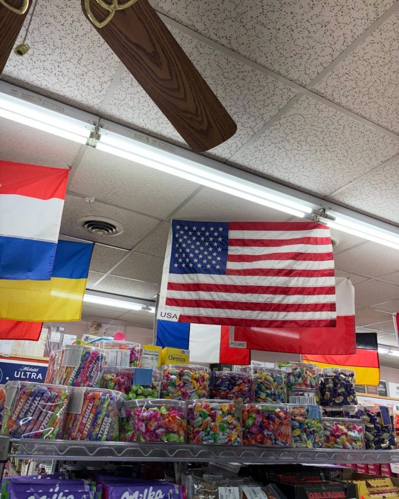 Flags from many countries hanging over the aisles at Mike's