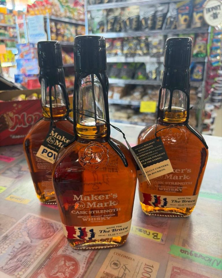 Three bottles of Maker's Mark bourbon on the counter