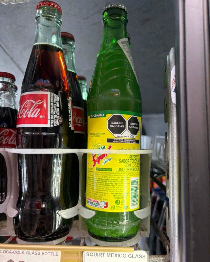 Glass-bottle Coca-Cola and Squirt in the cooler